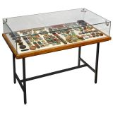 Museum Showcase with Collection of Needle Tins